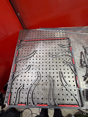 Red VHB tape is placed on the shelves around the perimeter
